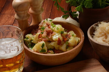 Kartoffelsalat - traditional German potato salad. Potato salad with bacon