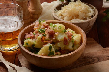 Kartoffelsalat - traditional German potato salad. Potato salad with bacon
