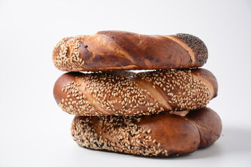 Fresh bread bagel with poppy and  sesame coating. Jewish or  German  form of sweet-filled pastry