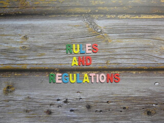 Words Rules and regulations on wood background