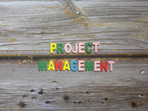Words Project management on wood background