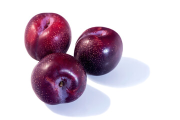 Ripe juicy fresh plum on an isolated white background. 