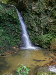 Fototapeta na wymiar View of Kandela waterfall near Tindoli village on the banks of lake Poso, Central Sulawesi, Indonesia