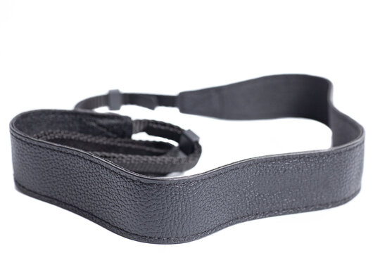 Black leather camera strap isolated on white background