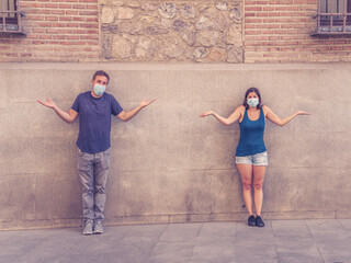 Obraz na płótnie Canvas Man and woman keeping social distancing. Coronavirus COVID-19 protection