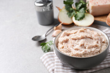Delicious lard spread in bowl on light table. Space for text