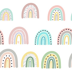 Seamless vector pattern with drawn rainbows. Scandinavian children's texture for fabric, wraps, textiles, Wallpaper, clothing. Illustration on a white background.