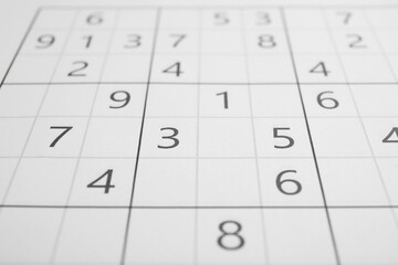Sudoku puzzle grid as background, closeup view