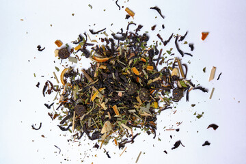 Brewing mixture with healthy herbs, tea and dried fruits on a white background. Selective focus