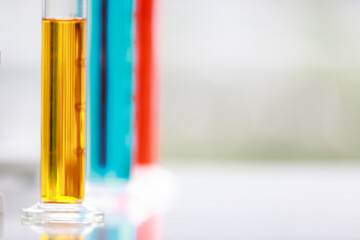Colorful water and liquid in beager and test tube in laboratory.