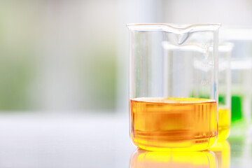 Colorful water and liquid in beager and test tube in laboratory.