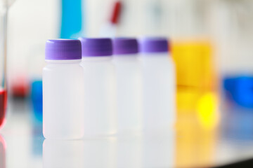Colorful water and liquid in beager and test tube in laboratory.