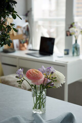 Bouquet of white ranunculus on the desk