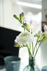 Bouquet of white ranunculus on the desk