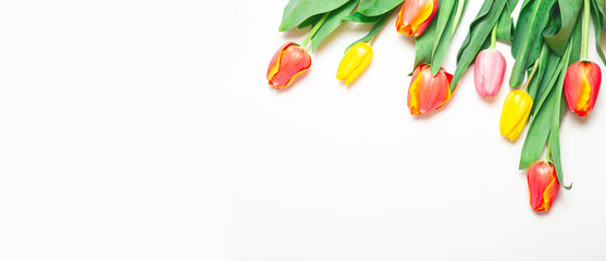 Bouquet of spring flowers on a white background. Mother's Day, Valentine's Day, birthday celebration concept. Top view, copy space for text.