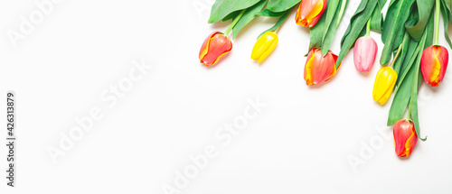 Bouquet of spring flowers on a white background. Mother's Day, Valentine's Day, birthday celebration concept. Top view, copy space for text.