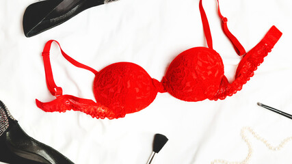 Sexy elegant lace red bra lingerie on white bed background. Fashion, Love, Sex, Valentine's day...