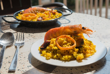Paella typical spanish food in granite background