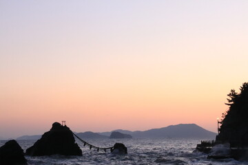 Beautiful orange ocean sunrise and isolated rocks (Married couple rocks in Mie Prefecture) /日の出の夫婦岩(三重県)