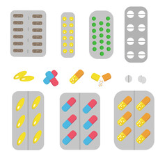A set of tablets and capsules in blisters. Pills of different colors