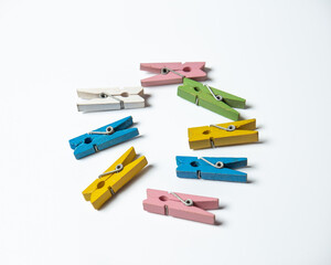 Several small clothespins with white background