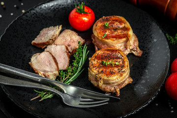 Cooking beef steak on grill served on black table for copy space text restaurant menu, top view
