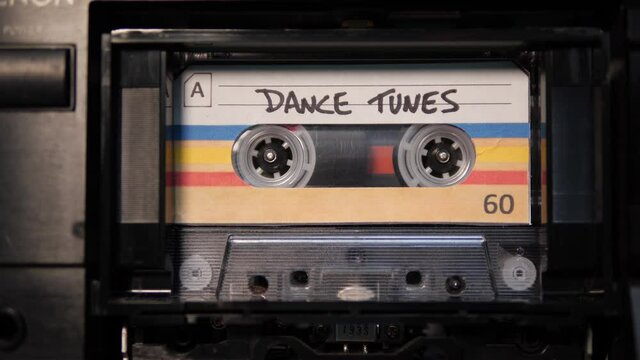 4K: Audio Cassette Dance Tunes Mix Tape playing in Recorder - Vintage retro music. Stock Video Clip Footage