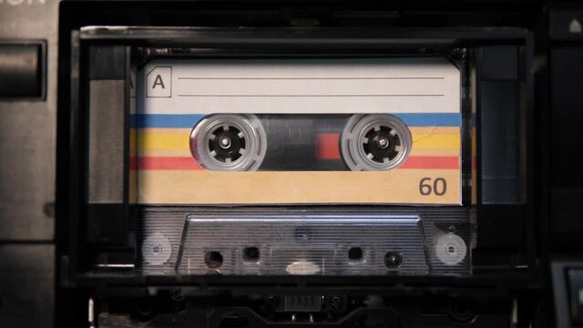 4K: Audio Cassette Tape playing in Recorder - Vintage retro Blank label music. Stock Video Clip Footage