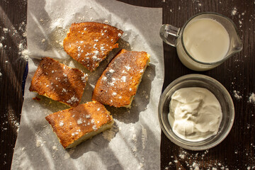 basque cheesecake with milk and sour cream on the table