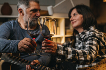 middle age romantic couple celebrating anniversary at home