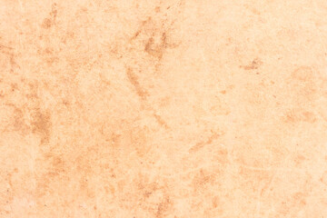 A sheet of old, worn cardboard, covered with stains and scratches. Simple light paper texture.