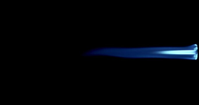 Butane gas burner flame burning from nozzle against black background. Welding tool with burner flame. Blue and Orange Flame from a butane blow torch. Closeup of butane burner.