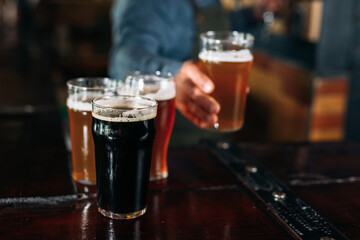 closeup of barman serving beer in pub