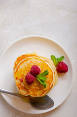 Delicious fluffy golden pancakes. Great idea for a sunny summer breakfast. A great treat for children.