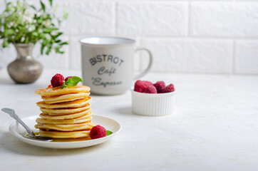 Delicious fluffy golden pancakes. Great idea for a sunny summer breakfast. A great treat for children.