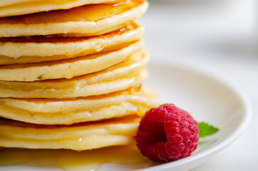 Delicious fluffy golden pancakes. Great idea for a sunny summer breakfast. A great treat for children.