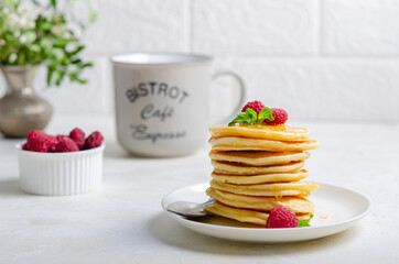 Delicious fluffy golden pancakes. Great idea for a sunny summer breakfast. A great treat for children.