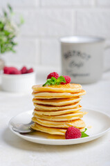 Delicious fluffy golden pancakes. Great idea for a sunny summer breakfast. A great treat for children.