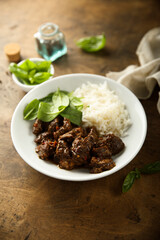 Homemade beef ragout with spinach and rice