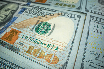 One hundred dollars pile as background. Macro shot of USA dollar. Value