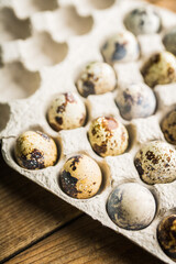 Quail eggs on the rustic background. Selective focus.