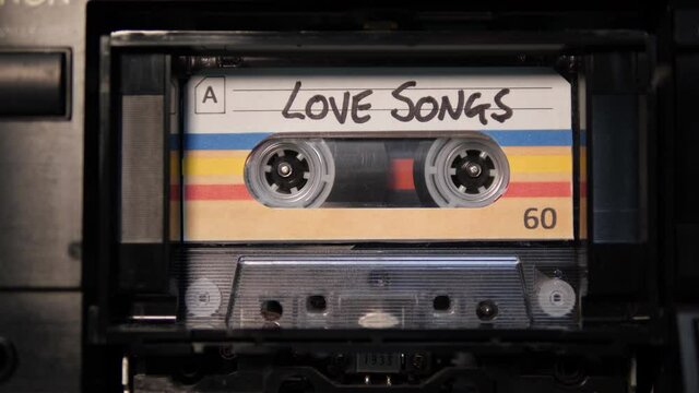 4K: Audio Cassette Love Songs Mix Tape playing in Recorder - Vintage retro music. Stock Video Clip Footage
