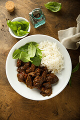 Homemade beef ragout with spinach and rice