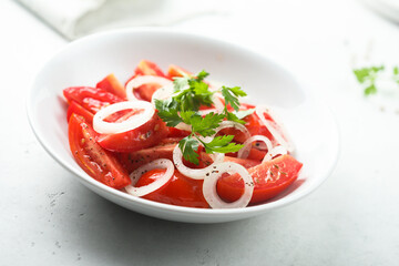 Healthy tomato salad with onion