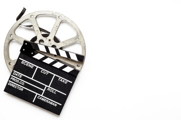 Big film reel with movie clapperboard, top view. Cinema concept
