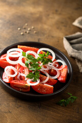 Healthy tomato salad with onion