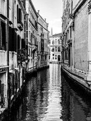 Fototapeta premium Small canal in Venice, Italy, with balcony, and, blue sky reflexion on water, no boat, no people