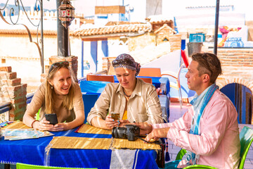Tourists have breakfast in a Moroccan cafe.