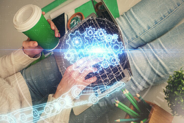 Double exposure of woman hands working on computer and data theme hologram drawing. Tech concept.