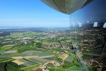 view reflected in the mirrored wall of the airship cabin